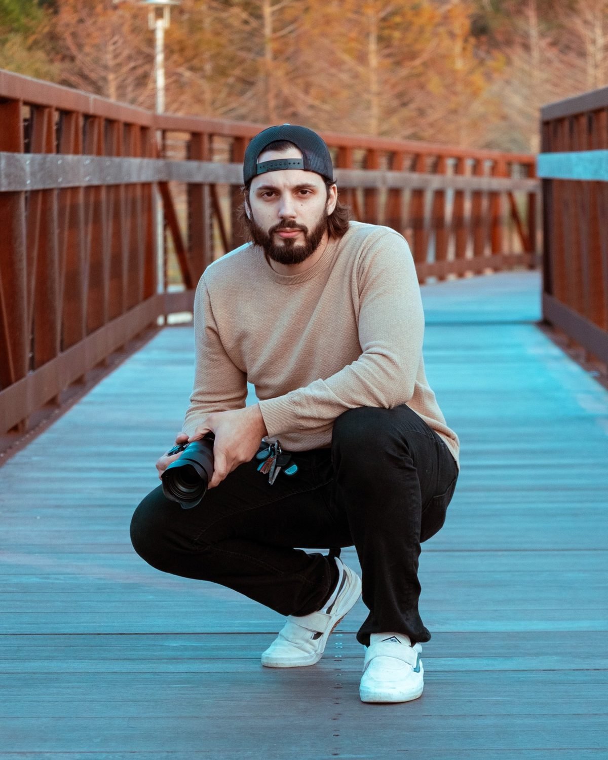Noah Bynum on a boardwalk with a camera