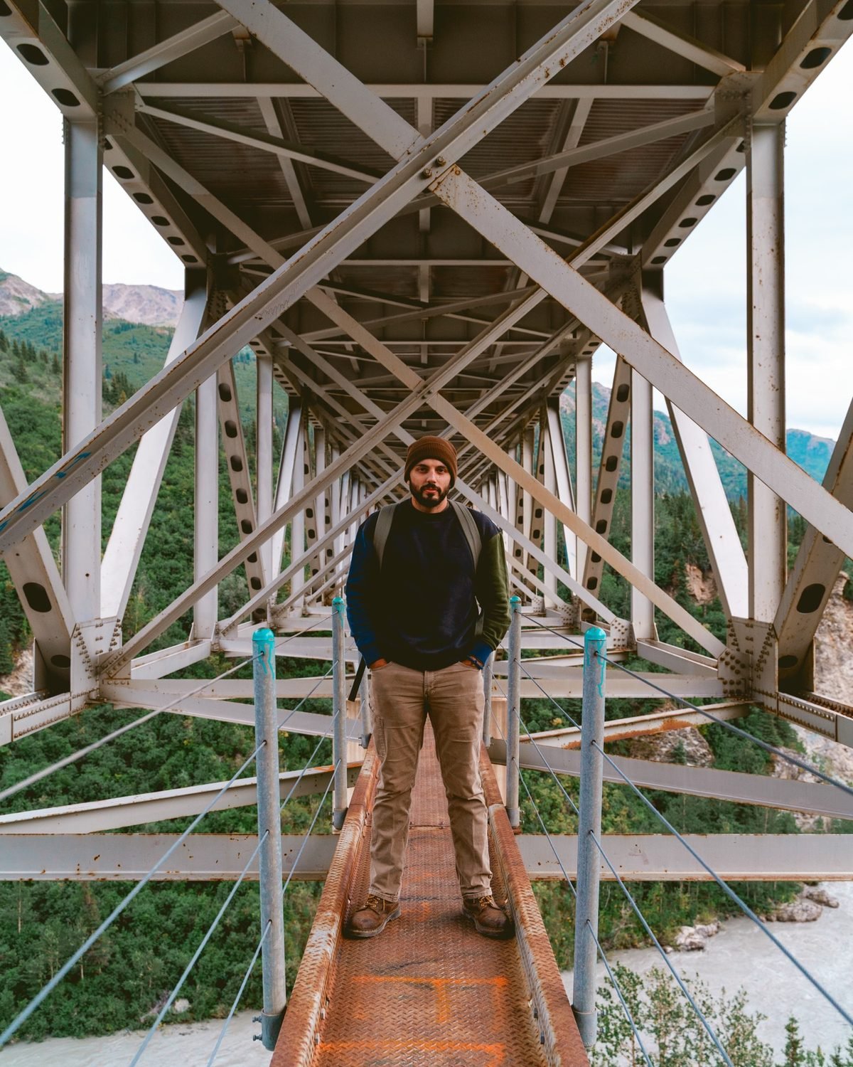 Noah Bynum on a steel truss bridge